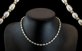 Ladies - Attractive and Nice Quality Pearl Necklace Set with 9ct Gold Spacers and Clasp.