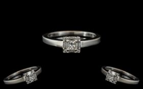 Platinum Set - Attractive Diamond Set Dress Ring. Marked PT 950. The Princes Cut and Emerald Cut