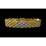 An 18ct Gold Diamond Set Bracelet panther design, central links set with round brilliant cut