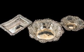 Three Silver Pin Dishes, two embossed one pierced, all fully hallmarked. Gross Weight 111 grams.
