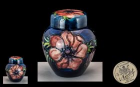 Moorcroft - Tubelined Lidded Jar of Small Proportions ' Anemone ' Range on Blue Ground. Label to