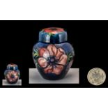 Moorcroft - Tubelined Lidded Jar of Small Proportions ' Anemone ' Range on Blue Ground. Label to