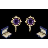 Ladies Pair of 18ct Gold Amethyst Set Earrings.