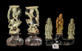 Collection of Carved Sandstone, comprising two carved candlesticks and three immortals.