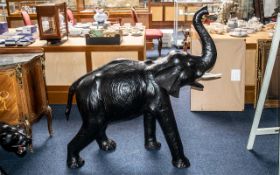 A Large Leather Clad Style Elephant trunk up, realistically modelled.