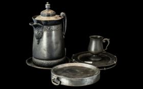 Mixed Metalware to include a tankard, a twin handled warming dish, two wall plates,