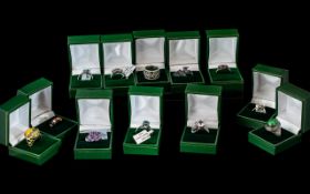 Collection of Twelve Silver Dress Rings, set with coloured crystals, stones, pearls, etc.