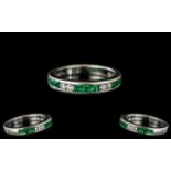 Ladies 18ct White Gold Attractive and Petite Diamond and Emerald Set Band Ring,