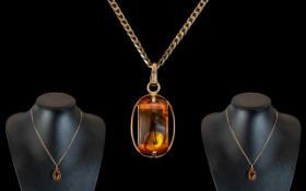 14ct Gold - Amber Set Pendant - Attached to a 9ct Gold Chain. Pendant Marked 585 - 14 ct. Chain