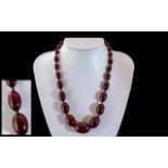 Edwardian Period Superior Quality Graduated Cherry Amber Beaded Necklace with gold clasp; 18.