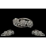 Ladies 18ct White Gold Attractive Triple Cluster Diamond Set Ring, the diamonds being well matched,