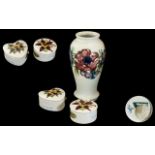 Three Pieces of Moorcroft, to include two trinket dishes and a 7" vase, Anemone pattern.