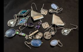 A Collection of Ten Silver Earrings set with hard stones, abalone shell amethyst etc. 70 grams.