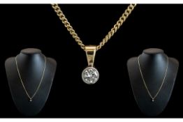 Ladies - Attractive 9ct Gold Single Diamond Set Pendant Attached to a 9ct Gold Chain.