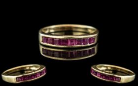 14ct Yellow Gold - Attractive Ruby Set Ring. The Eight Princes Cut Rubies of Good Colour.