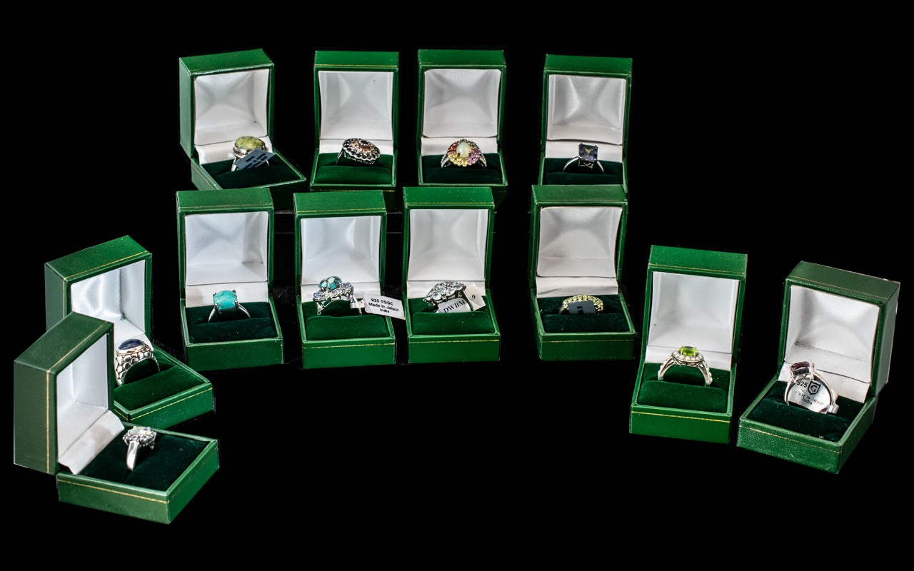 Collection of Twelve Silver Dress Rings, set with coloured crystals, stones, pearls, etc.