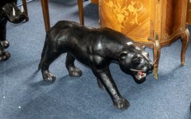 A Large Black Panther realistically modelled. Leather clad style.