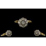 Antique Period 18ct Gold and Platinum Diamond Set Cluster Ring of petite proportions,