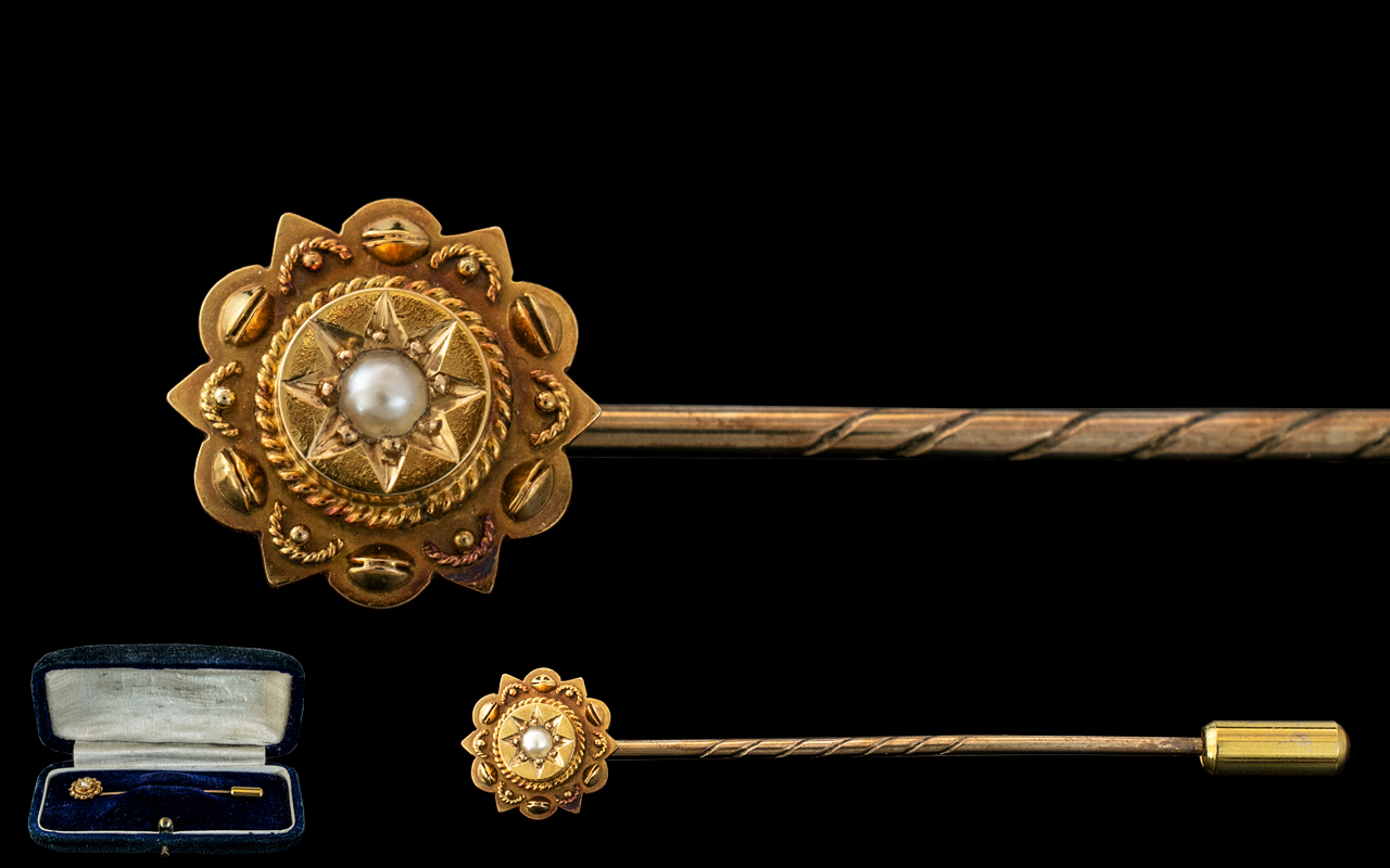 A 15ct Gold Stick Pin Set with a Sea Pearl Stamped 15ct approximately 60 mm.