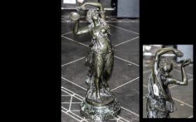 A Bronze Figure of a Dancer with Grapes raised on a circular marble base. Height 20 inches.
