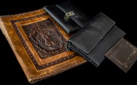 An Italian Black Leather Wallet, together with a black leather purse, a card case,