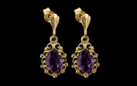 Pair of Attractive 9ct Gold Amethyst Set Drop Earrings.