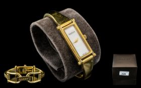 Ladies Gucci Bracelet Watch, No.1500L, pearl face with gold hands, gold tone bracelet.