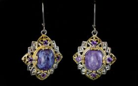 Siberian Charoite and Amethyst Two Tone Elegant Drop Earrings, each earring having an oval cut