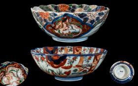 Chinese Late 19th Century Pair of Pleasing Hand Painted Imari Pattern Footed Bowls with scalloped