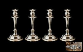 A Set of Four Good Quality H Samuel silver plated candlesticks.