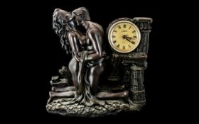 Mantle Clock & Sculpture, depicting a couple embracing, with the clock set into a column.