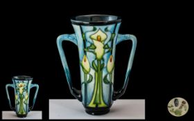 Moorcroft Twin Handled Tubelined Vase, Calla Lilies pattern designed by Emma Bossoms.