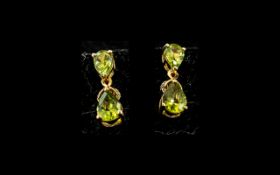 Pair of Peridot Pear Drop Earrings, the