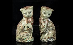 Pair of Matching Oriental Cats, 7" high, decorated with figures and flowers, marks to base.