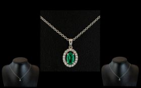 A 14ct Gold Emerald and Diamond Pendant Central Emeralds Surrounded by Round Modern Brilliant Cut