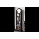 An Art Deco Long Cased Clock with silver dial, with Arabic numerals,