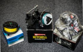 Three Fishing Reels to include a Garcia Mitchell Spinning Reel 386, a Silstar ET70 Spinning Reel,