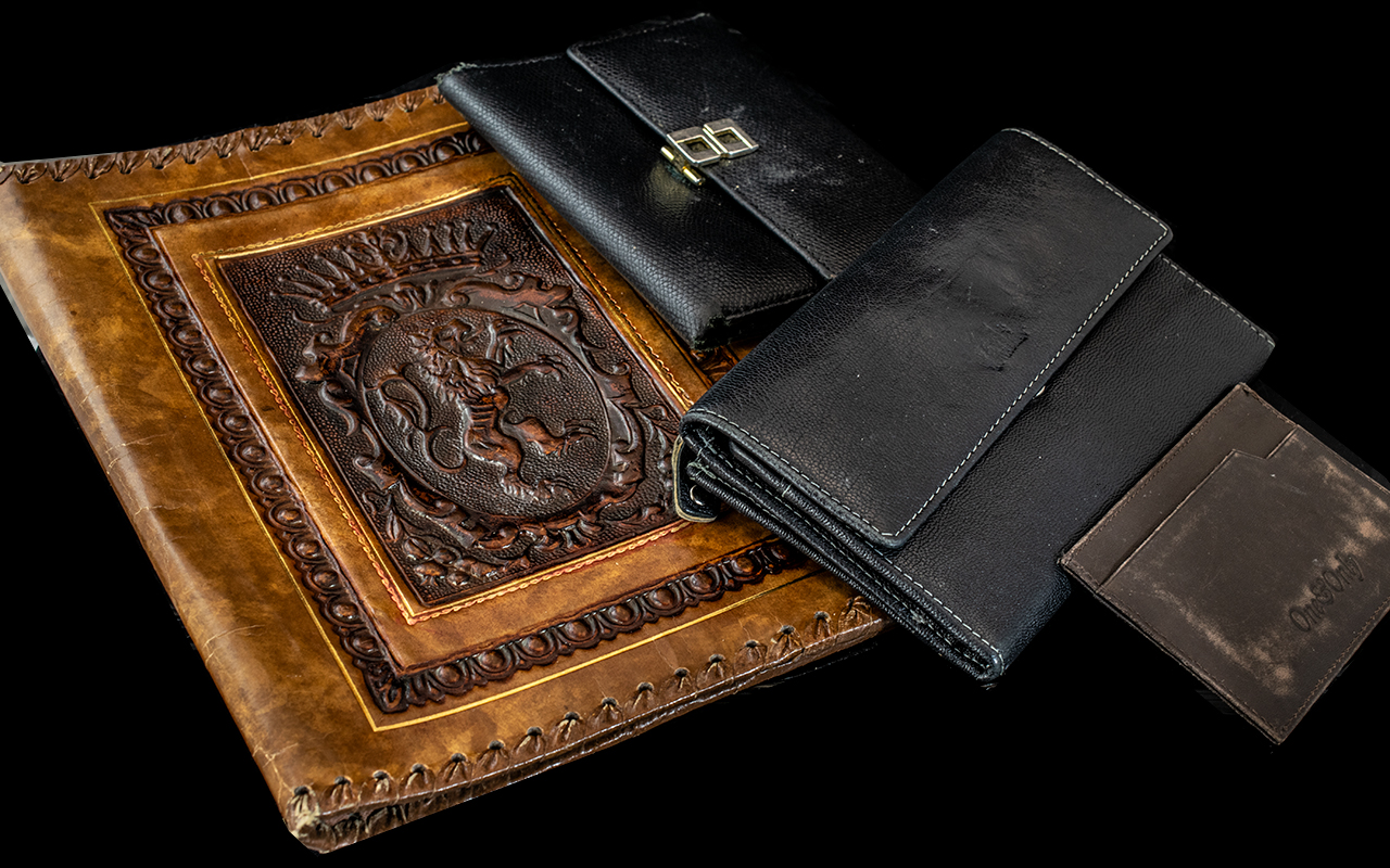 An Italian Black Leather Wallet, together with a black leather purse, a card case, and a continental