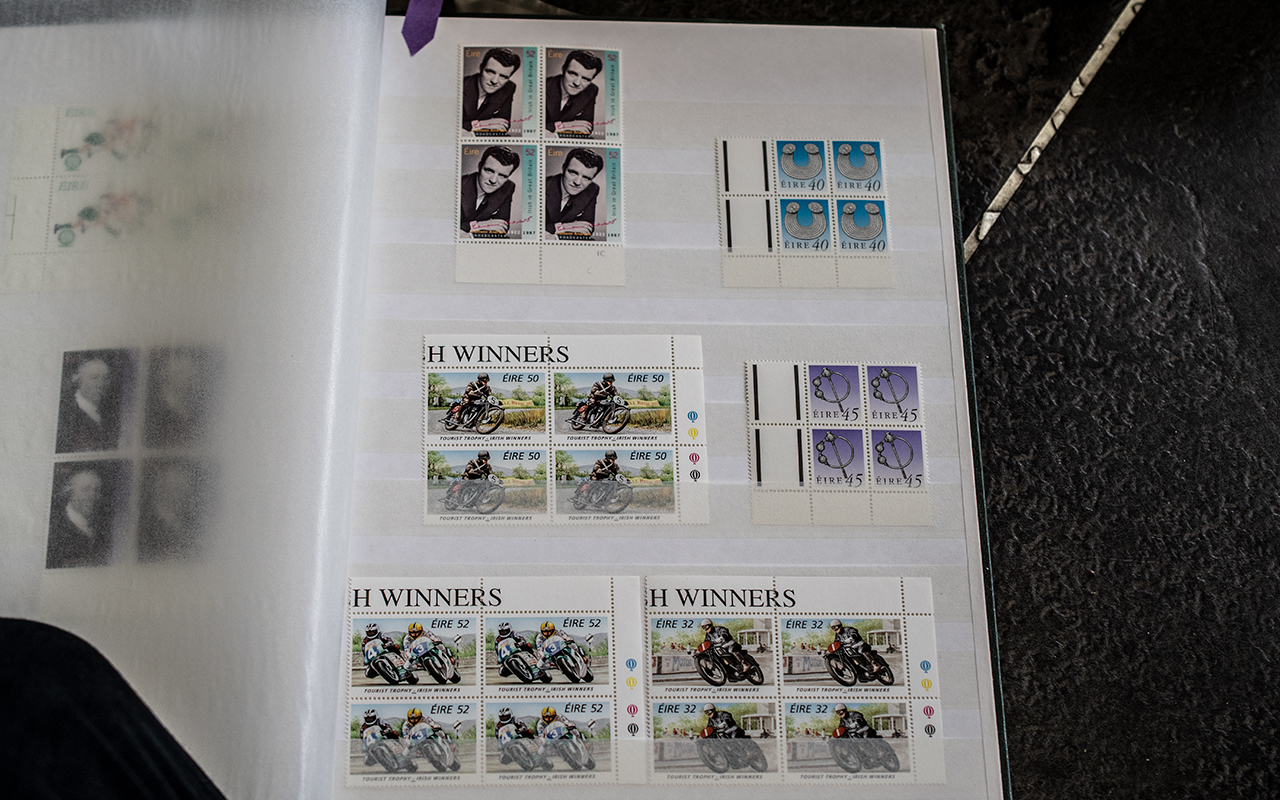 Two stock books of Irish commemorative stamps, mostly in unmounted mint blocks of four (Just a few