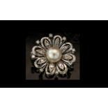 18ct White Gold Diamond Pearl Flower Brooch Central Pearl Surrounded By Round Cut Diamonds.