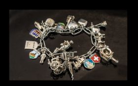 A Good Quality Vintage Sterling Silver Charm Bracelet, Loaded with 25 Silver Charms.