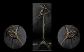 A Decorative Bronzed Ballerina Sculpture raised on marble effect plinth. Measures 60 cms in height.