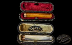 Antique Period - Pair of 9ct Gold Banded Cigarette Holders with Mother of Pearl and Amber Stems.