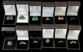 Collection of Twelve Silver Dress Rings, set with coloured crystals, stones, etc.