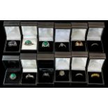 Collection of Twelve Silver Dress Rings, set with coloured crystals, stones, etc.