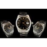 A Gents Rolex Oysterdate Ref 6694, black dial, with baton numerals, stainless Rolex bracelet,