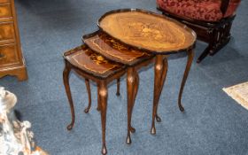 Polished Inlaid Nest of Three Tables, oval shaped with inlaid floral design.