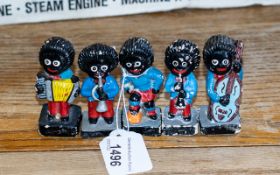 Four Jolly Band Figures, together with a Jolly Boy Footballer figure As found.