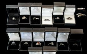 Collection of Fourteen Silver Dress Rings, set with coloured crystals, stones, etc.