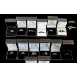 Collection of Fourteen Silver Dress Rings, set with coloured crystals, stones, etc.